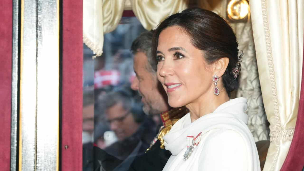 Denmark's King Frederik X and Queen Mary ride in a coach in Copenhagen