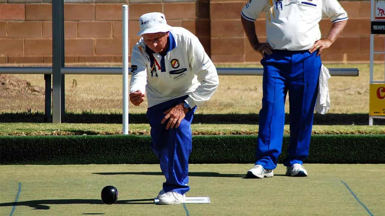 Trevor Fielden (left) plays lawn bowls in Adelaide.