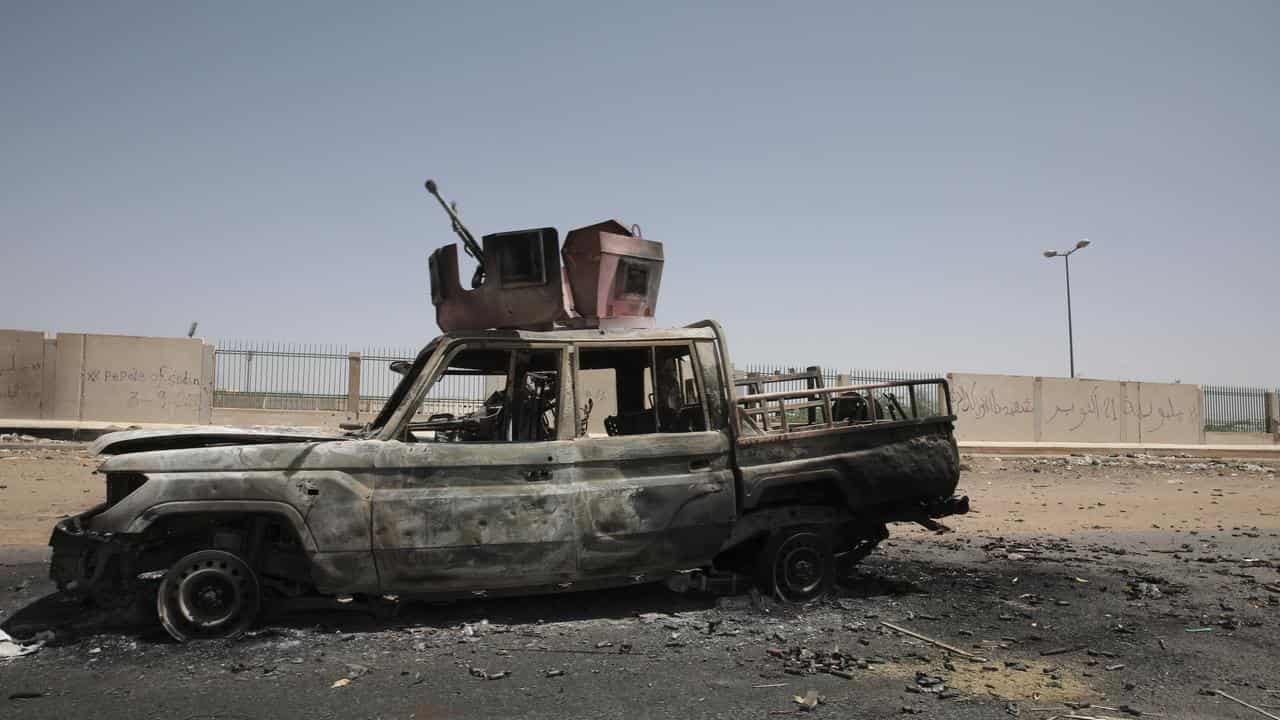 A destroyed military vehicle in Khartoum