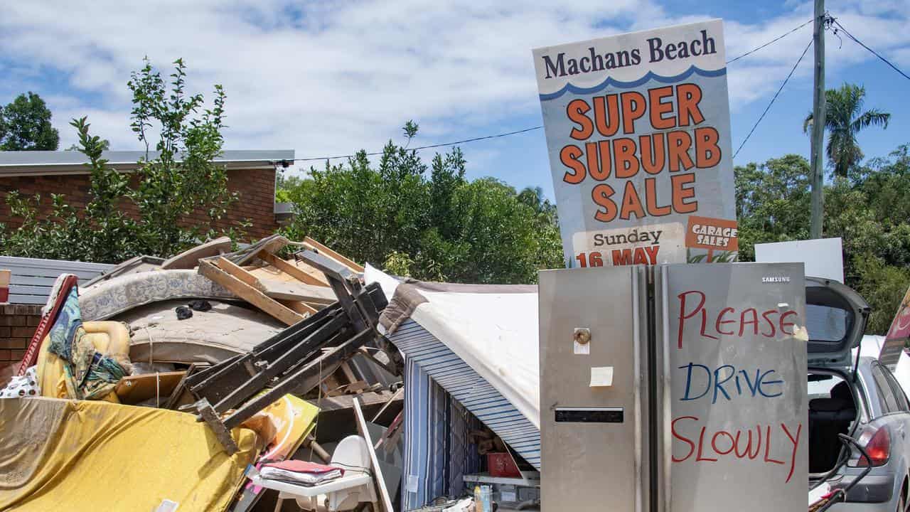 Flood damaged furniture line houses at Machans Beach in Cairns