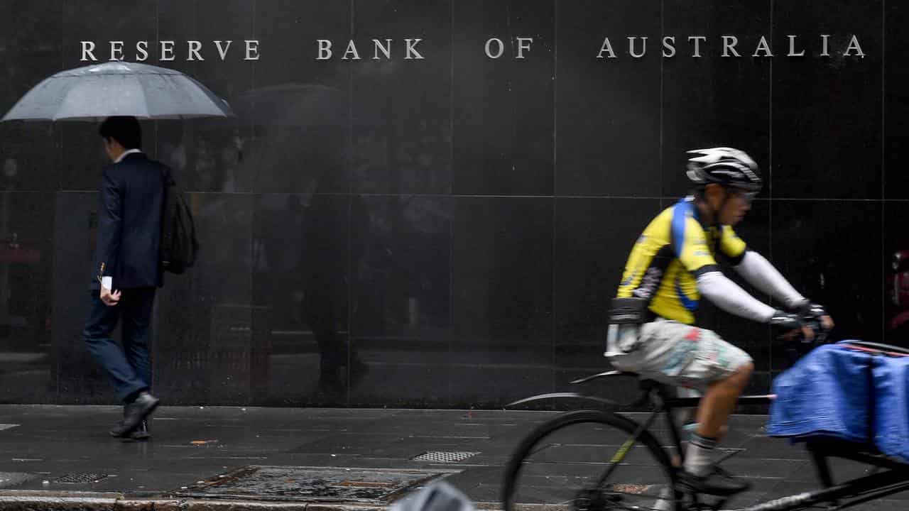 Pedestrian and delivery rider outside the Reserve Bank (file image)