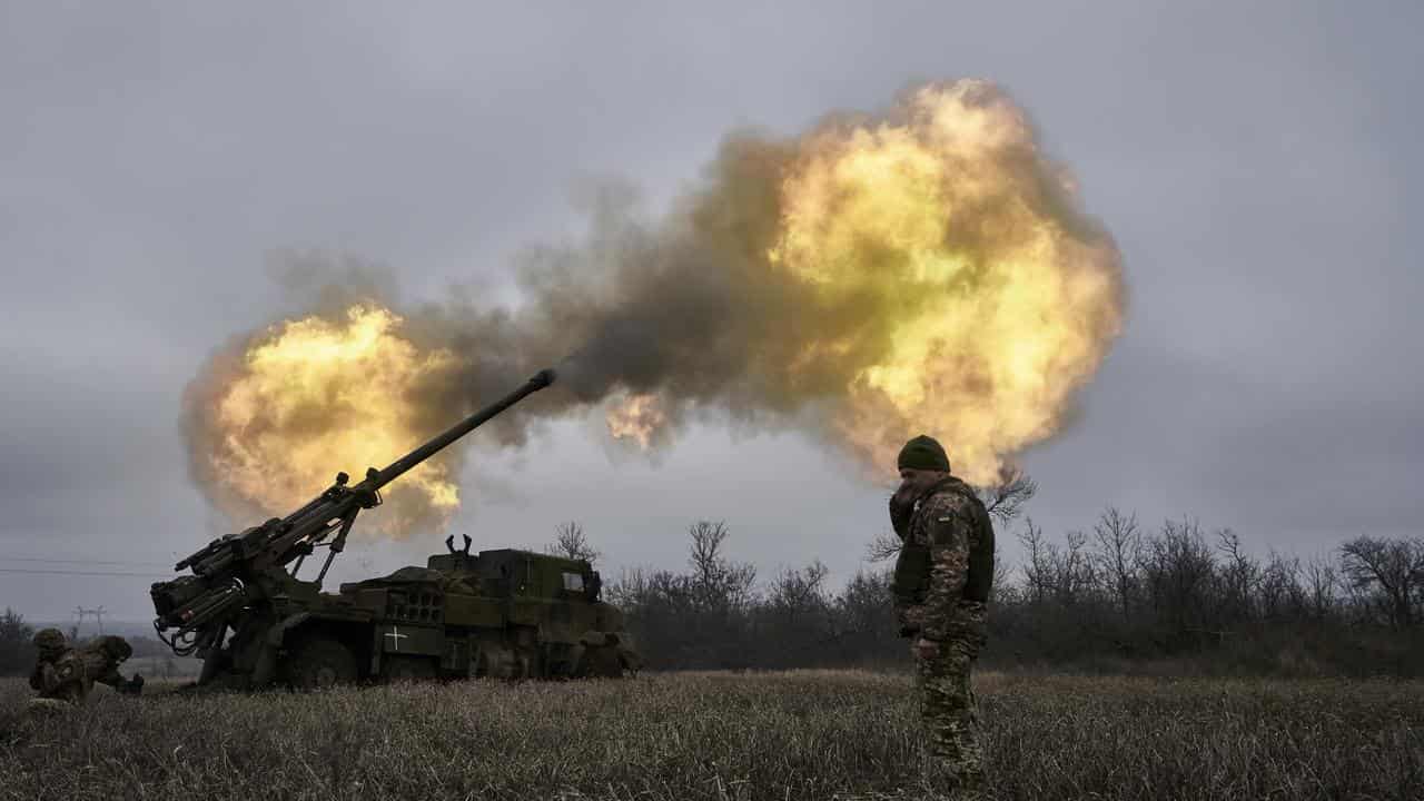 Ukrainian soldiers fire a French-made howitzer at Russian positions