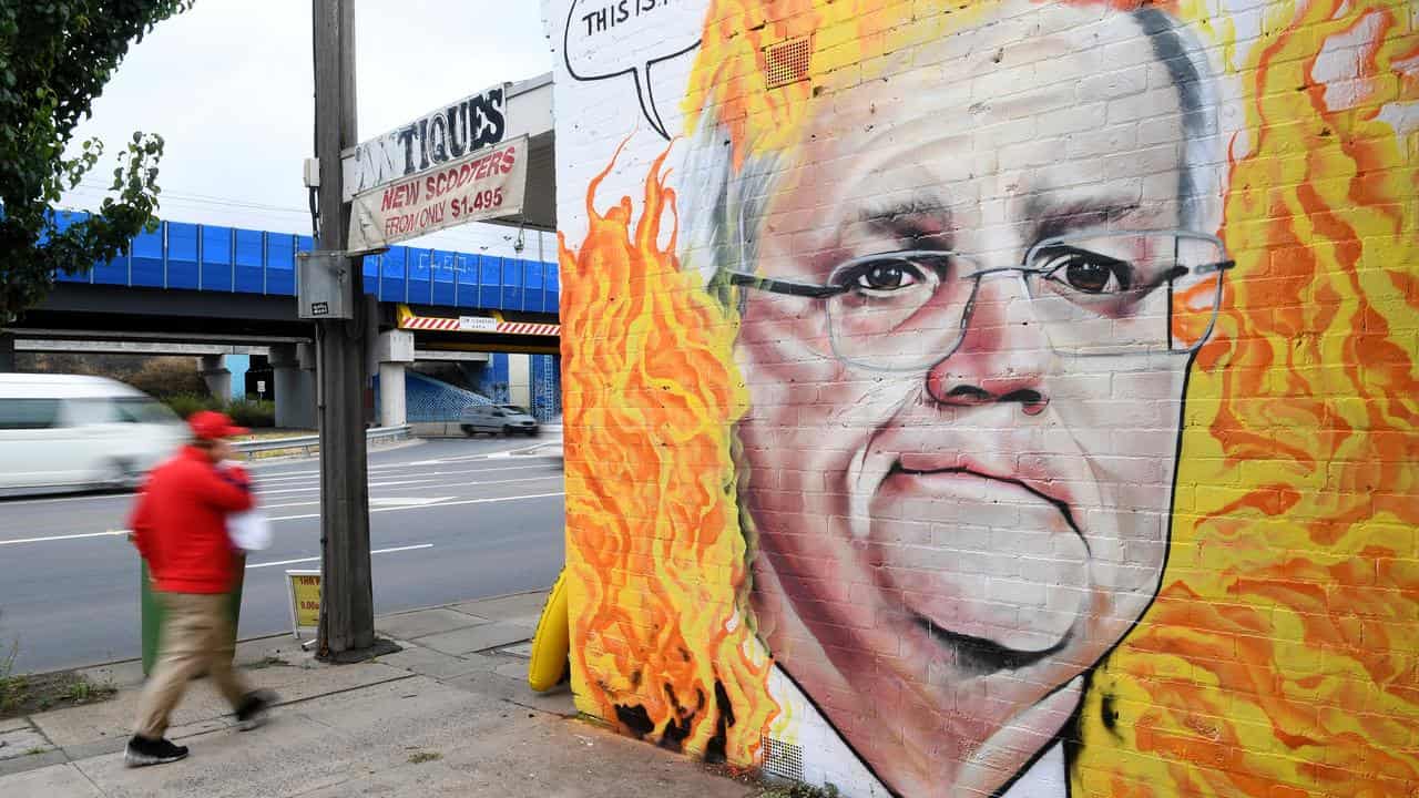 A mural of Scott Morrison among flames.