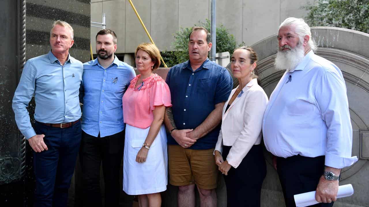 Family members of the police offers killed outside court