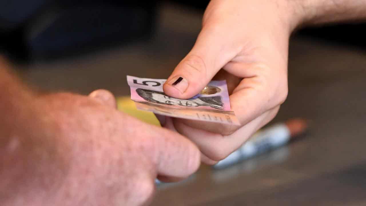 Cash payment being made (file image)