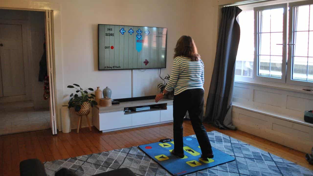 Woman uses Smart Step exercise program developed by NeuRA.