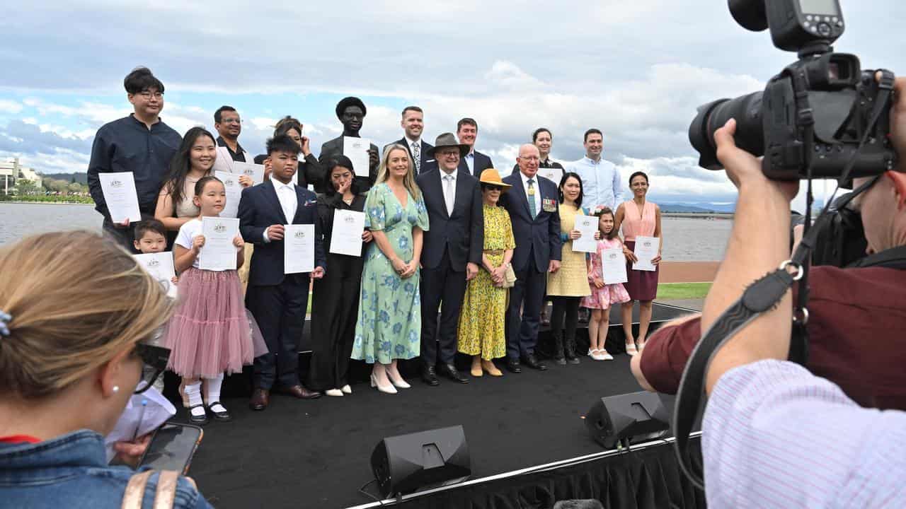 The PM and governor general with newly sown citizens.