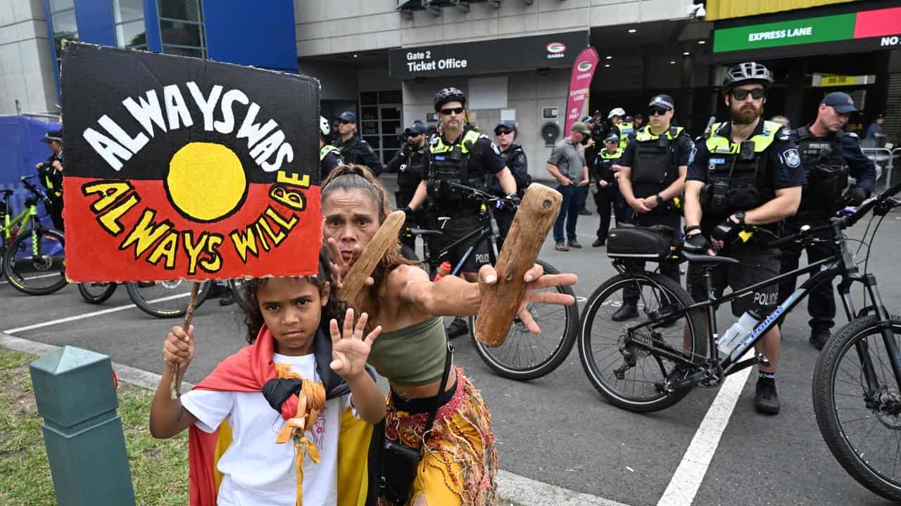 Anti-Australia Day protesters protesting outside the Gabba