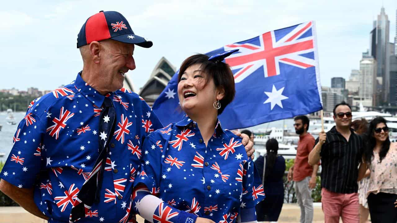 Man and woman dressed in Australian flag shirt and pants 