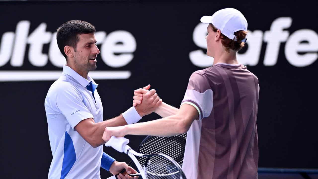 Novak Djokovic (left) congratulates Jannik Sinner. 