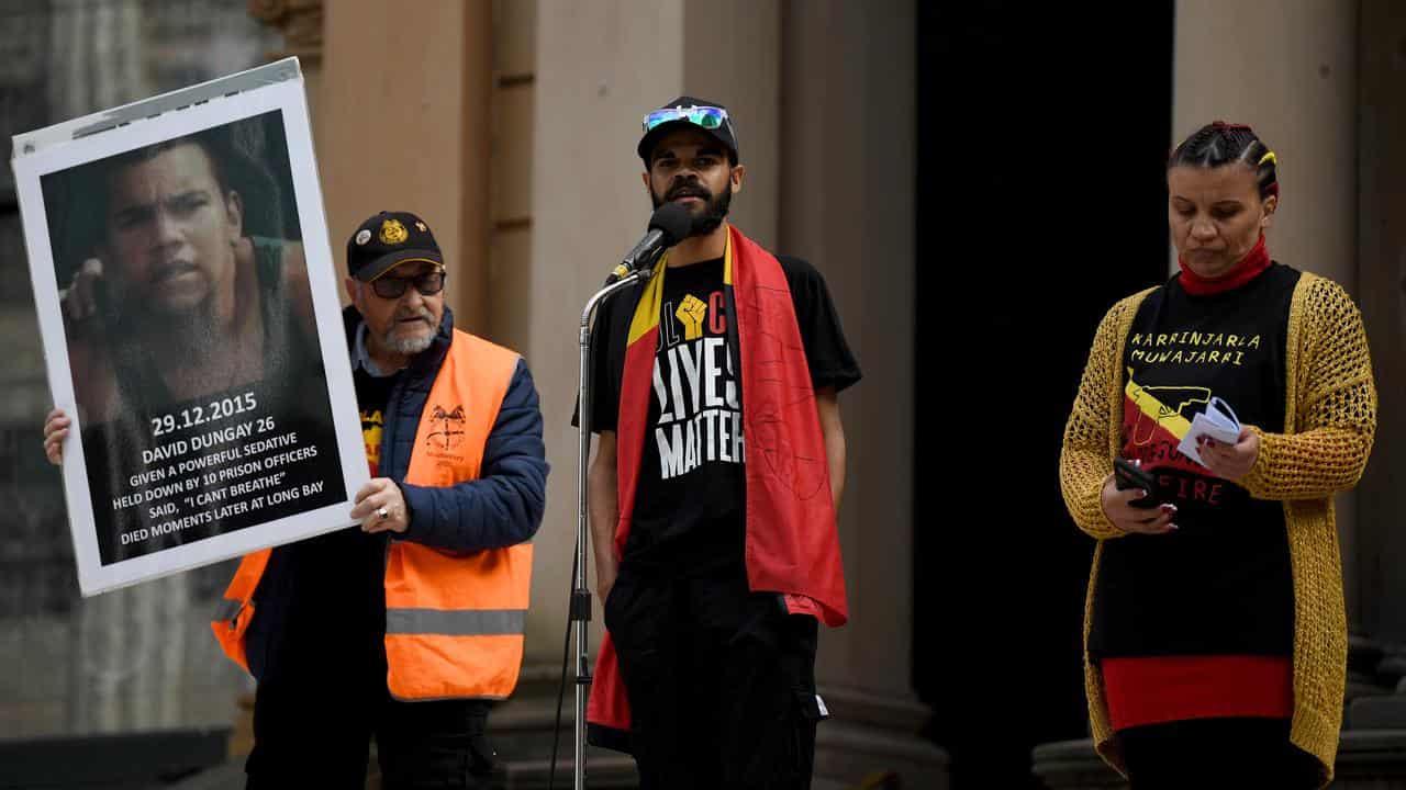 A file photo of Paul Silva (centre)