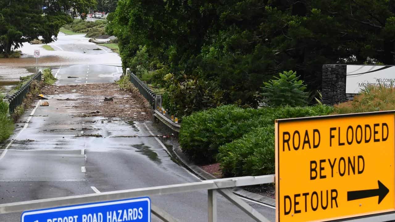 A flooded South Pine River is seen over a bridge