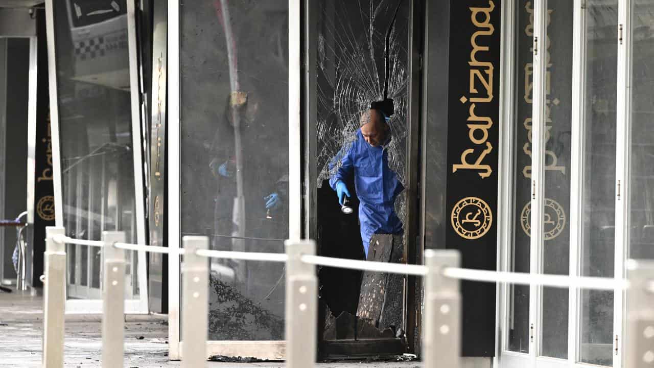 Police at the scene of fire Karizma restaurant at Docklands