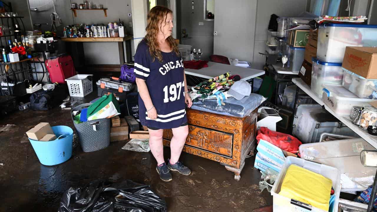 Madeleine Higgs at her flood damaged property in Bray Park