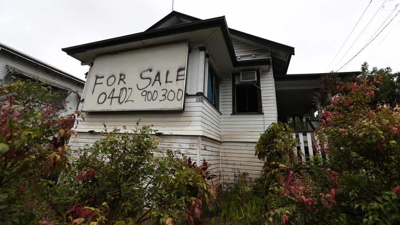 A house with a for sale sign in Lismore