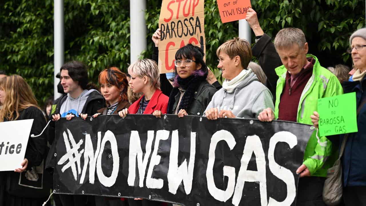 Protesters outside Federal Court during a case against Santos.