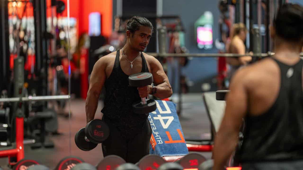 Bodybuilder Noor lifts weights at a Brisbane gym.