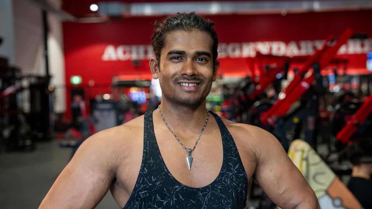 Noor Kabir poses for a photo at a Brisbane gym.