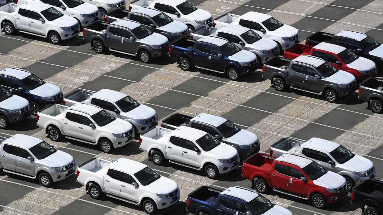 Imported vehicles sitting on a dock.