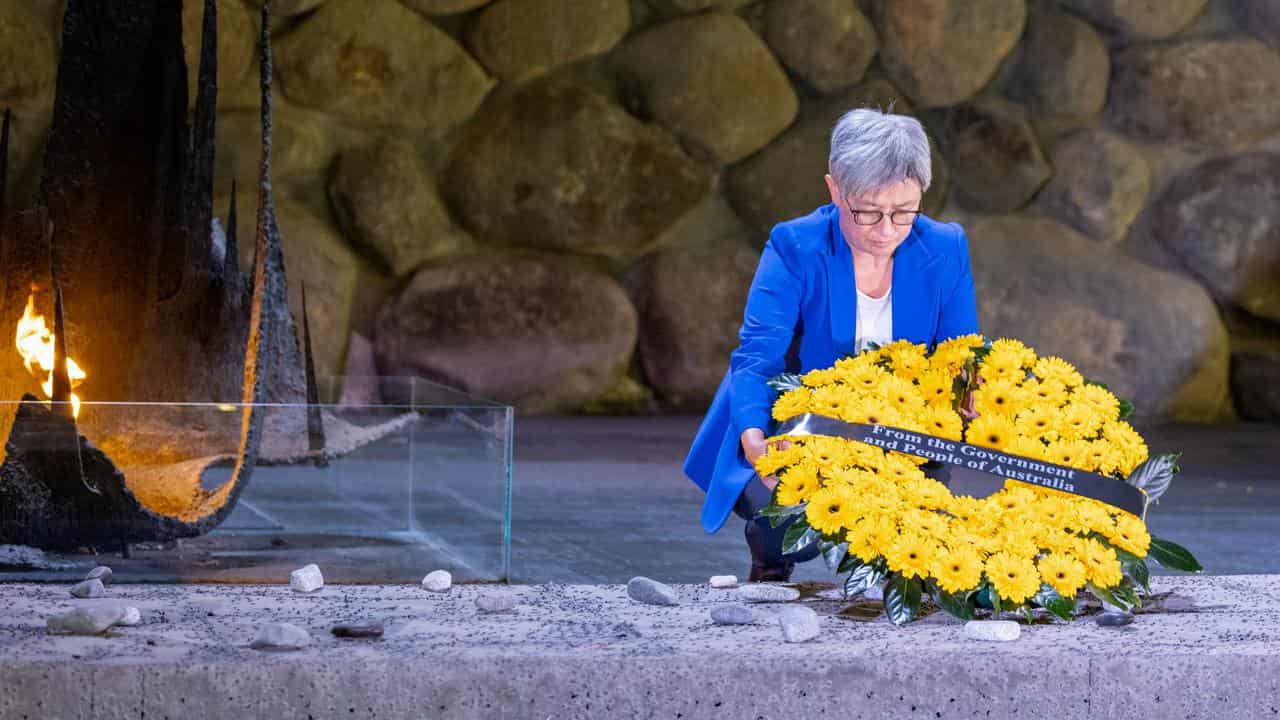 Penny Wong lays wreath at Holocaust remembrance centre