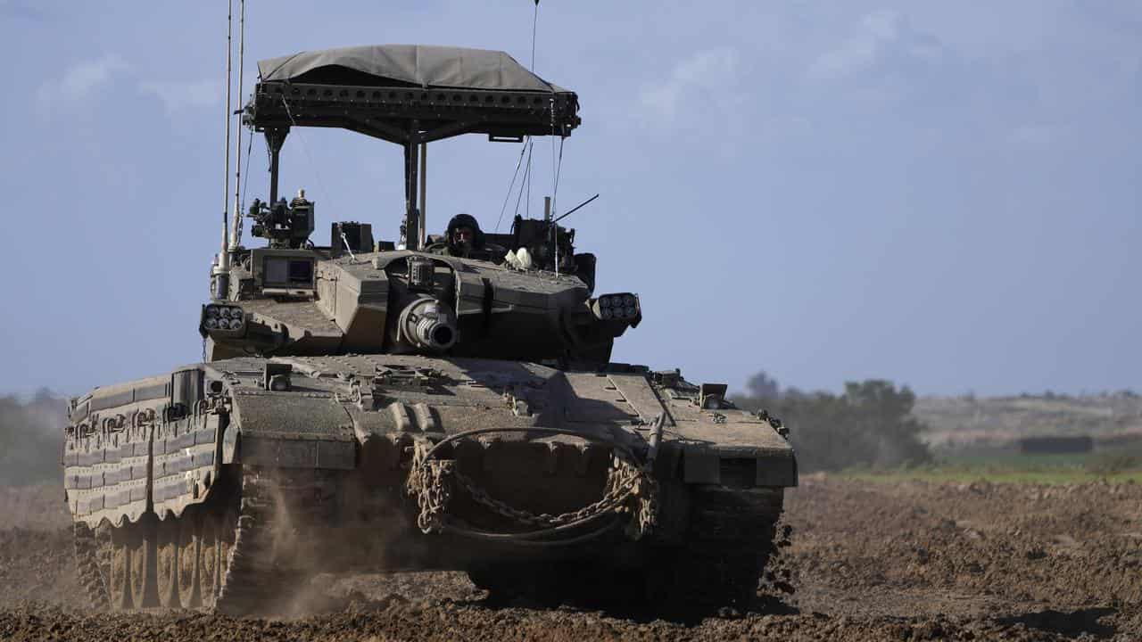 An Israeli tank as it returns from the Gaza Strip