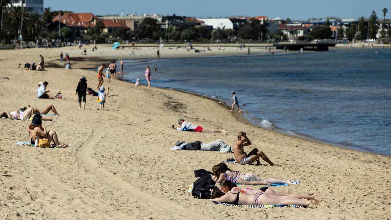 People are seen on St. Kilda’s Beach