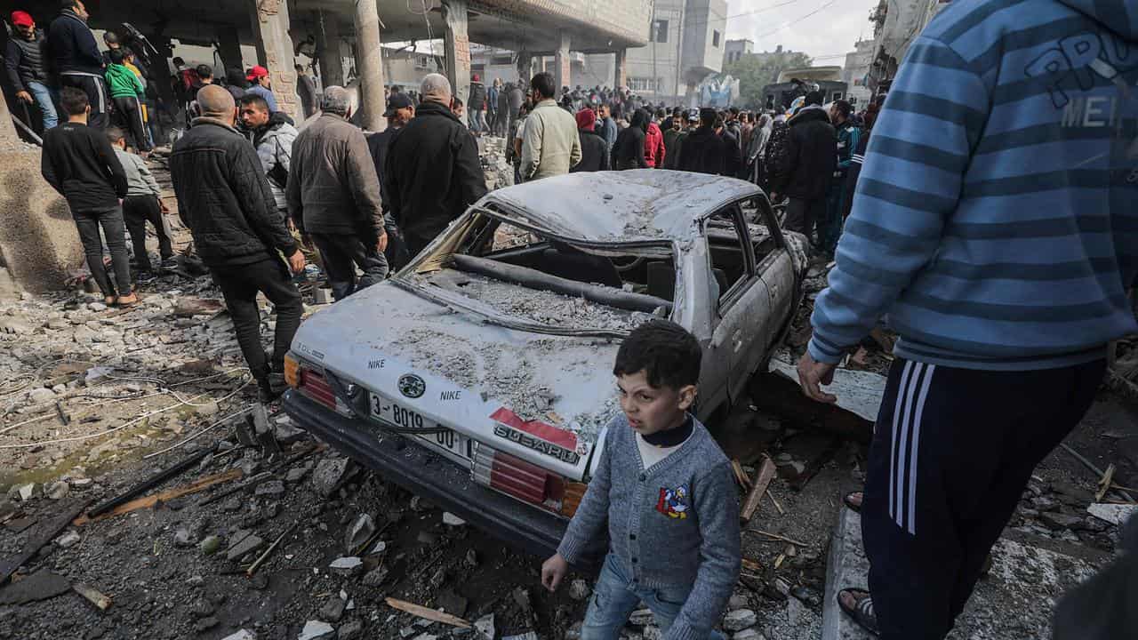 Palestinians search for missing people under rubble in Deir al-Balah.