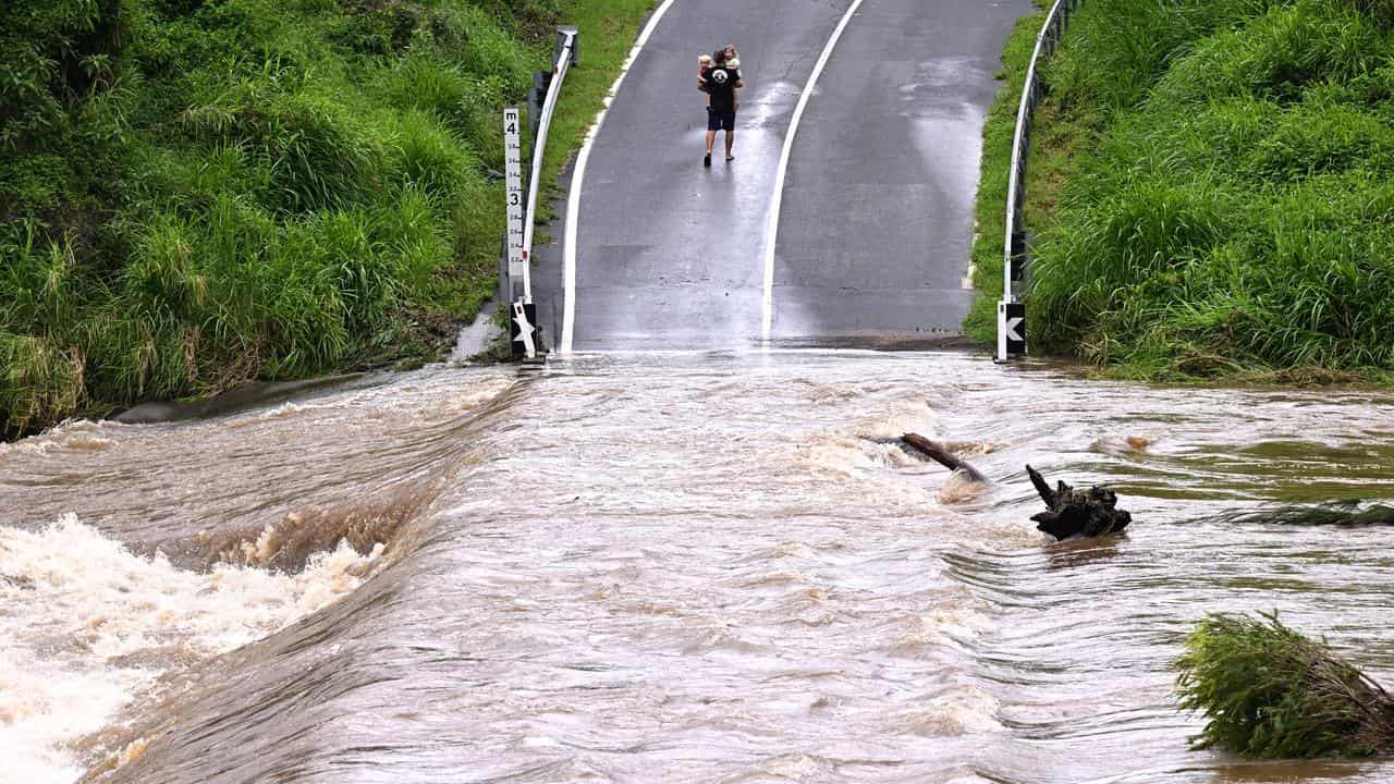 The flooded Coomera River