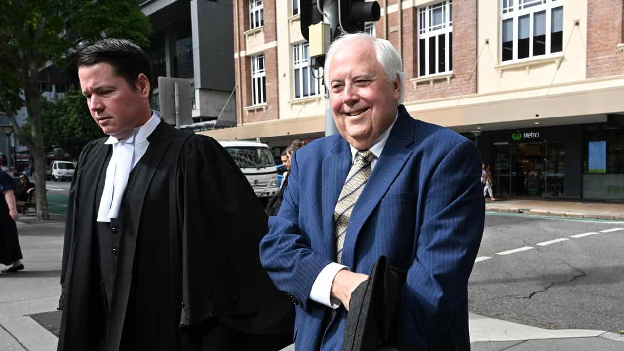 Clive Palmer (right) arriving at the Brisbane Court of Appeal