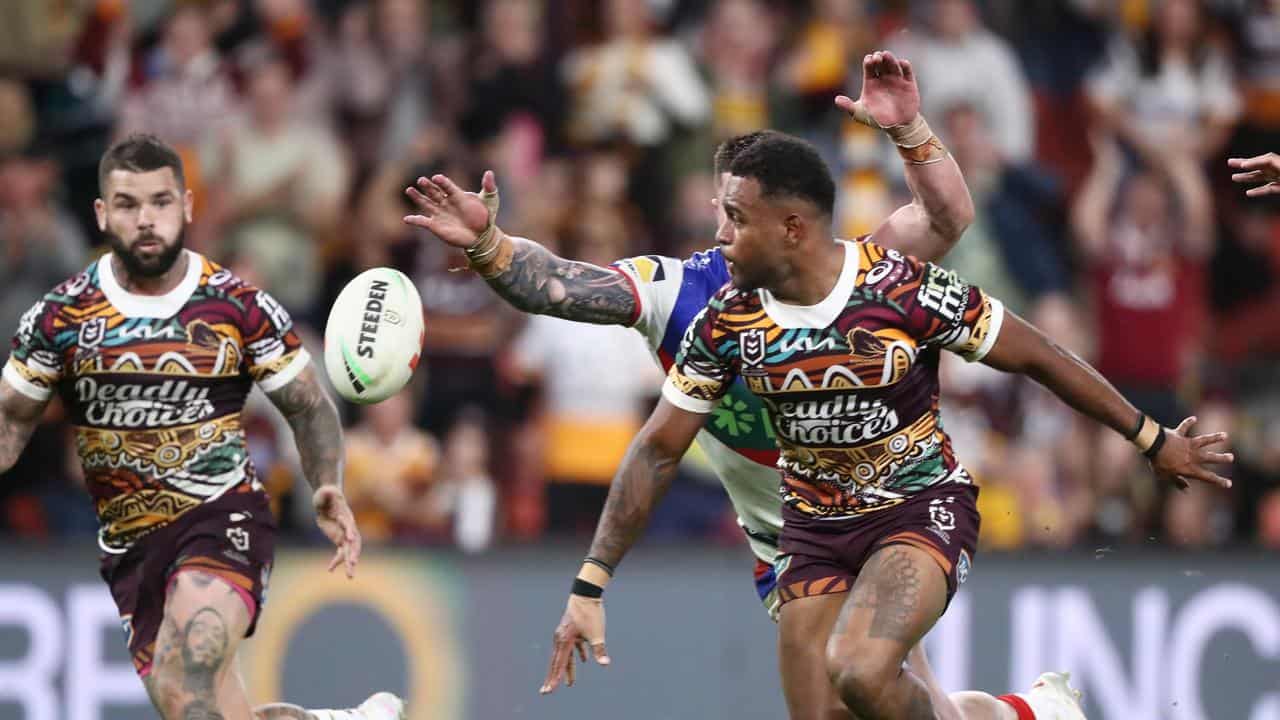 Ezra Mam (right) and Adam Reynolds (left) in action for Brisbane. 