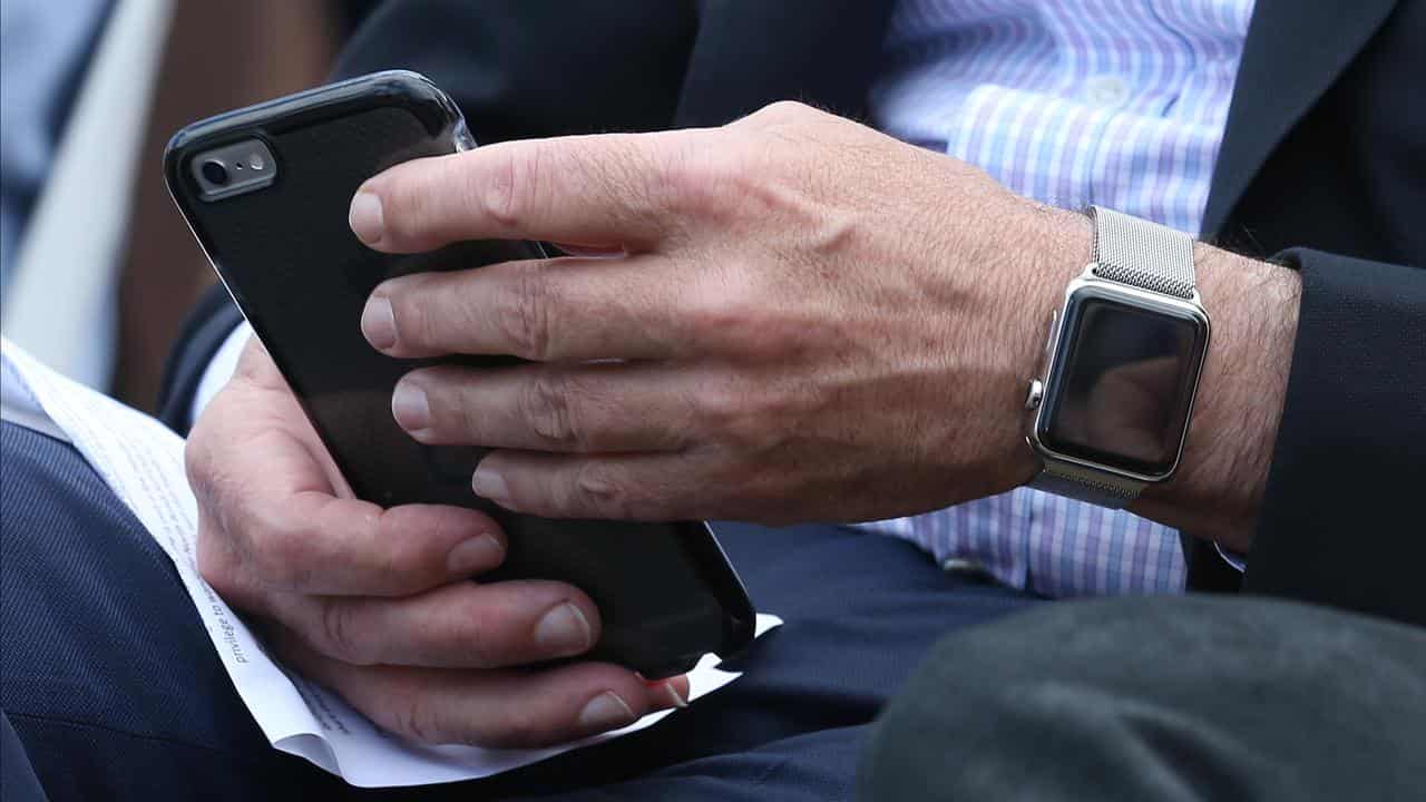 A smartphone and smart watch (file image)