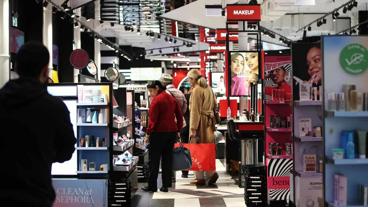 People shopping for cosmetics