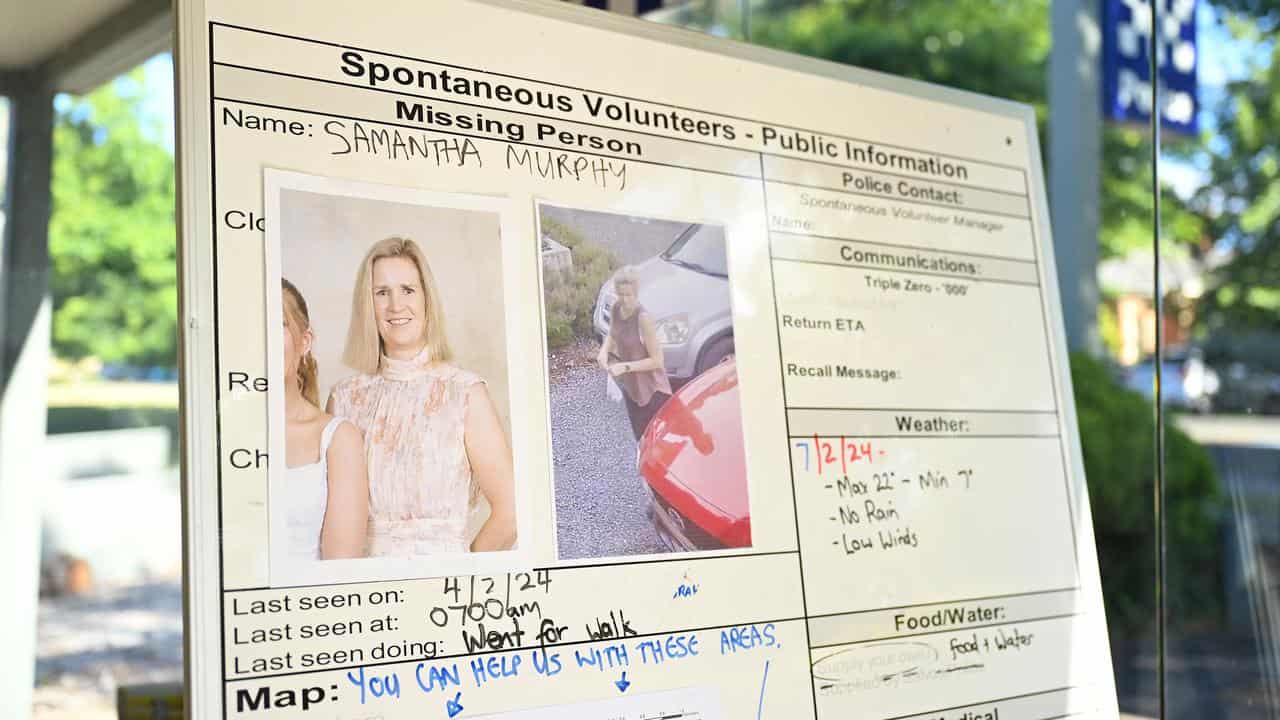 Sign with picture of missing woman