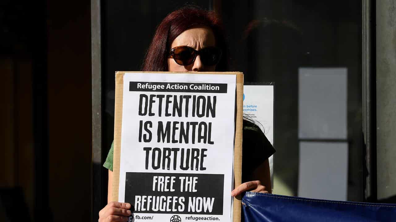 Protesters rally outside the Downing Centre Court, in Sydney