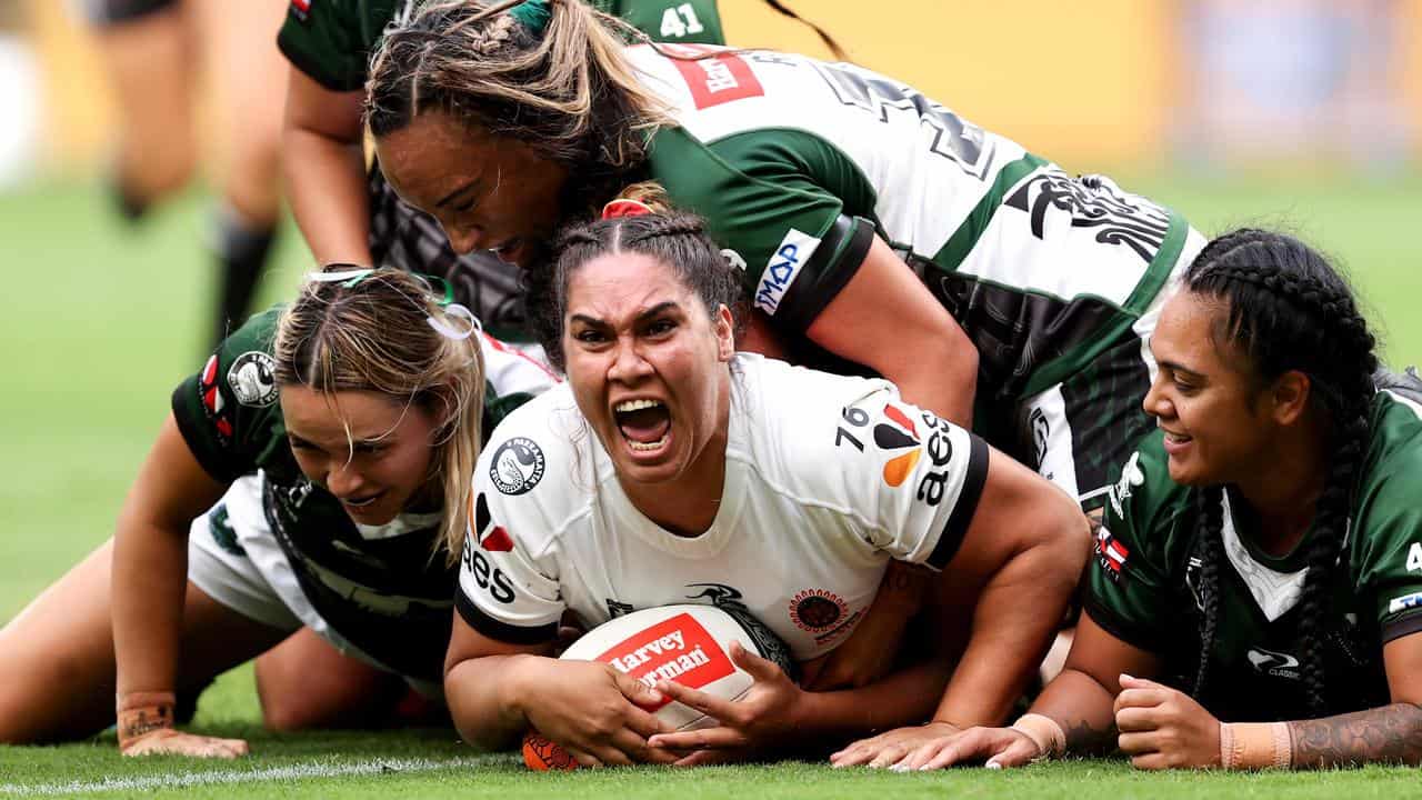 Tommaya Kelly-Sines (centre) of the Indigenous All Stars.