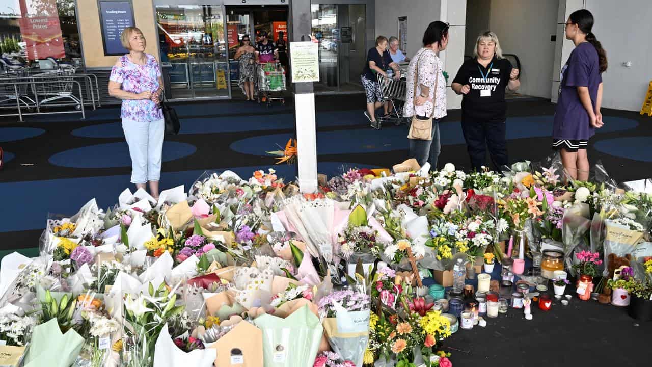 Flowers form a floral tribute to grandmother at shopping centre