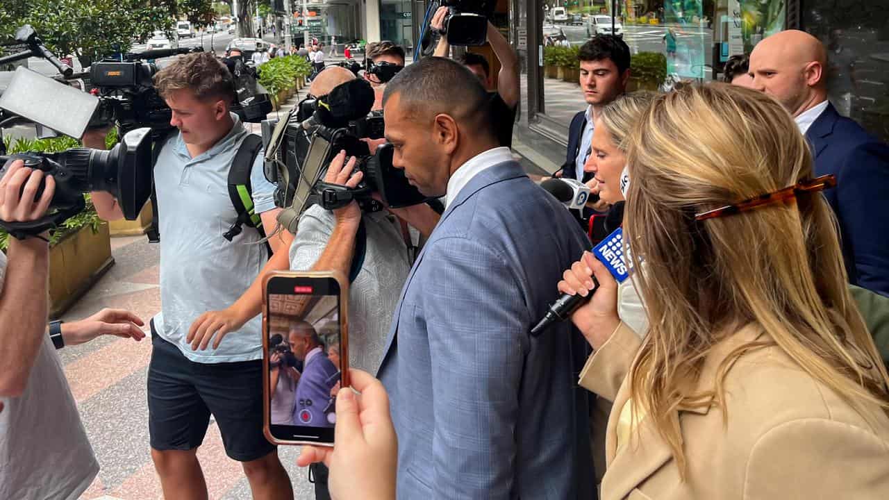 Kurtley Beale (centre) leaves the Downing Centre District Court