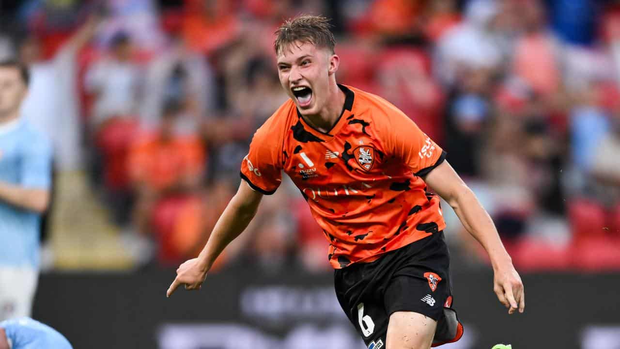 Roar's Thomas Waddingham celebrates one of his goals v Melbourne City.