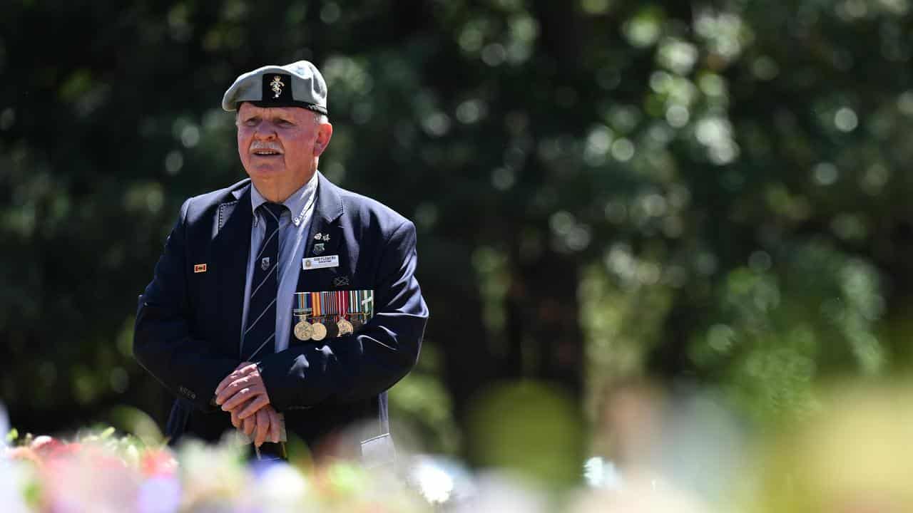 A veteran at the 20th anniversary service for the  Ex-POW Memorial.