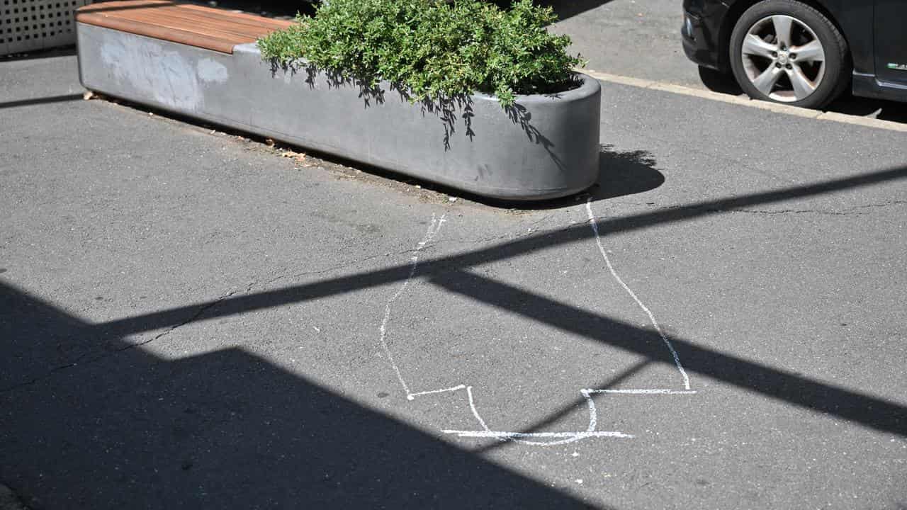 A chalk outline on the ground where Mr Joyce fell off a planter box.