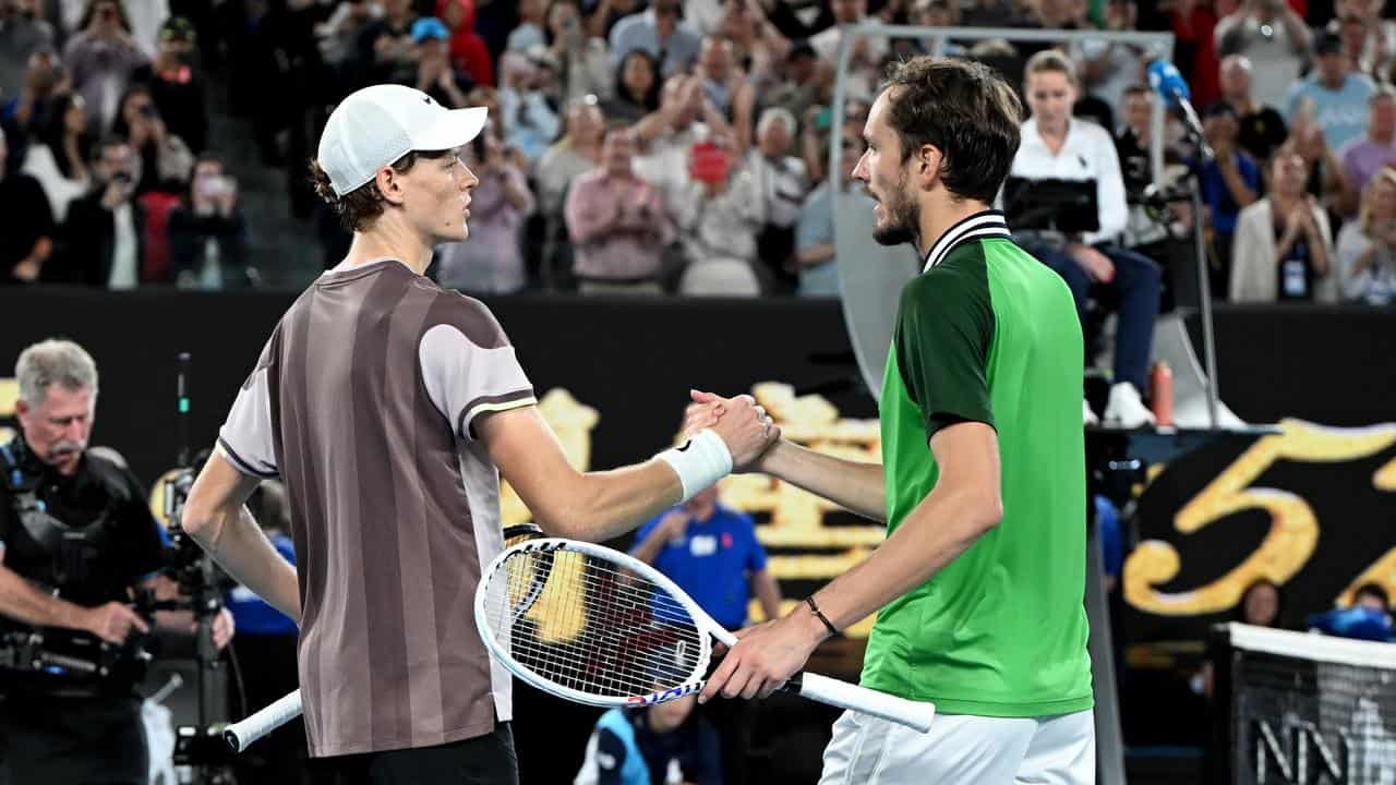 Jannik Sinner is congratulated by Daniil Medvedev after 2024 AO final.