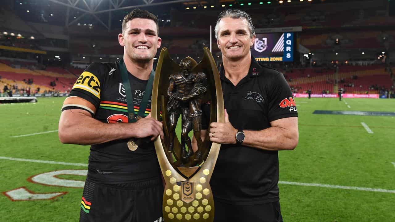 Nathan and Ivan Cleary with the trophy after the 2021 NRL grand final.