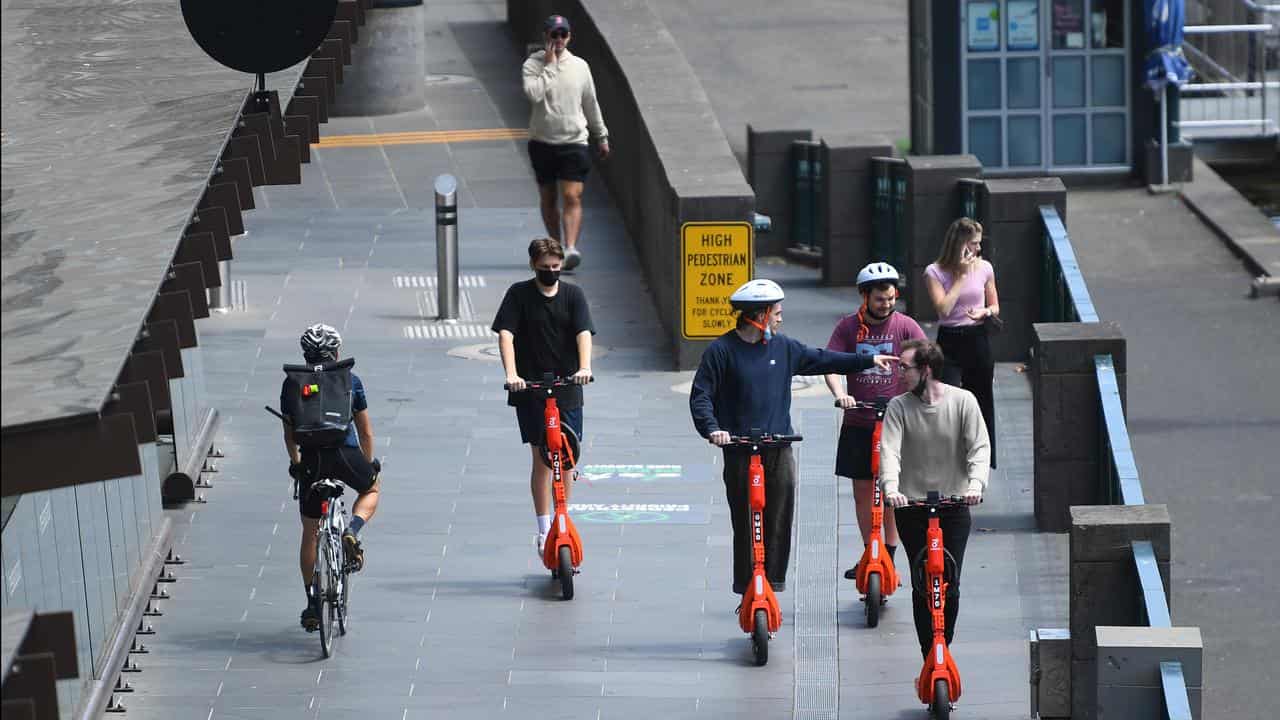 People riding e-scooters in Melbourne