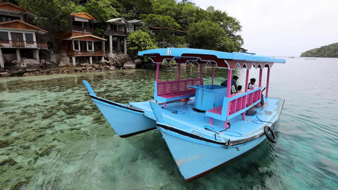 Tourists ride a water ferry on Weh Island, Sabang, Aceh, Indonesia