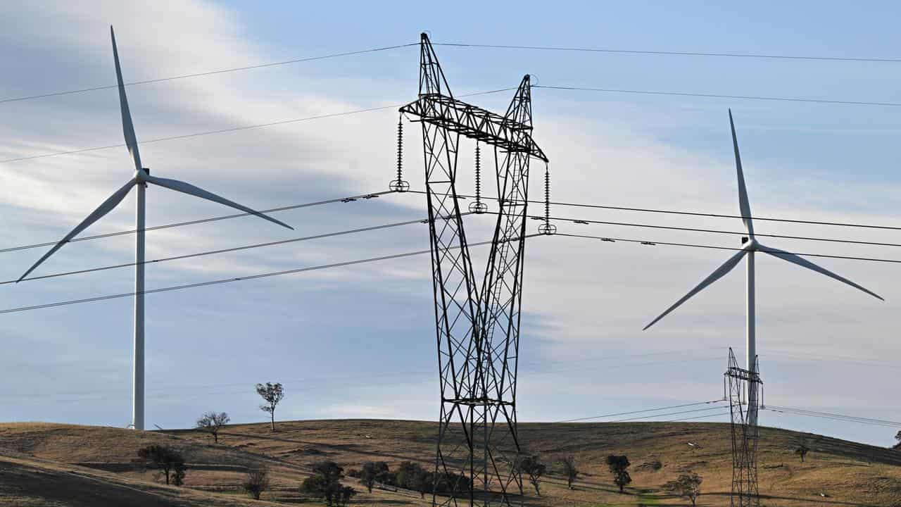 Wind turbines and electricity pylons.