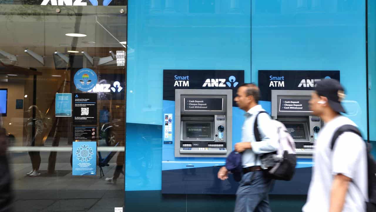 People walk past an ANZ storefront in Sydney