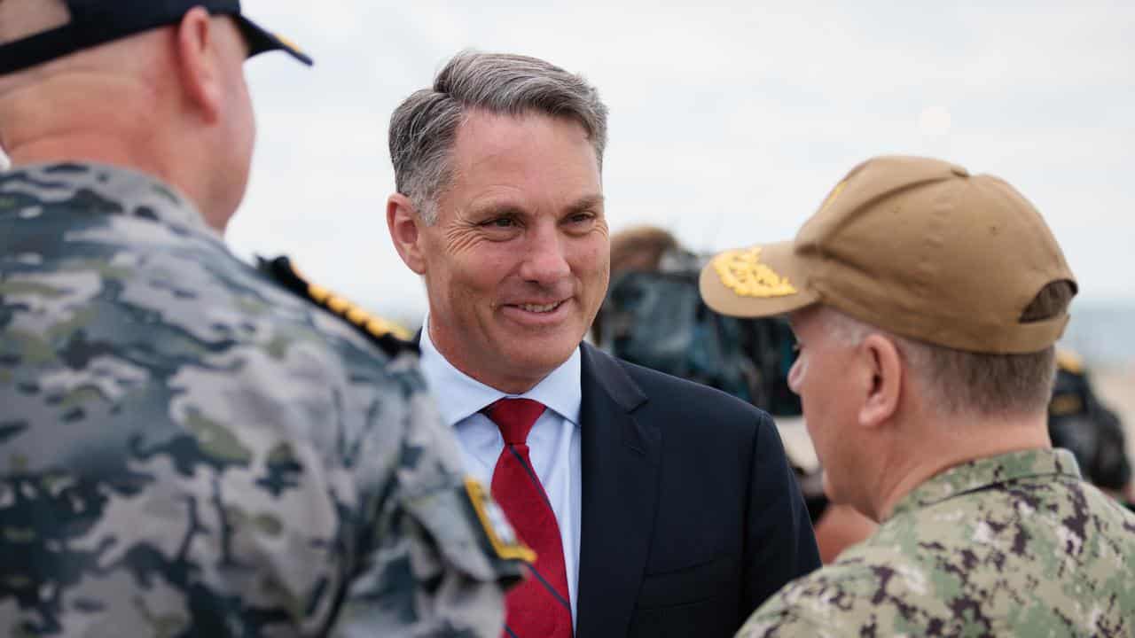 Defence minister Richard Marles speaking with US personnel in WA