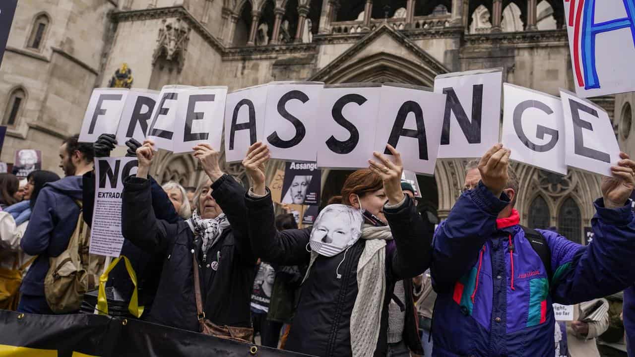 Julian Assange's supporters protest outside London's High Court