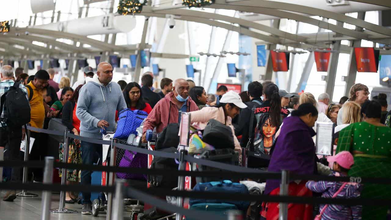 A crowd of Christmas travellers at Sydney airport.