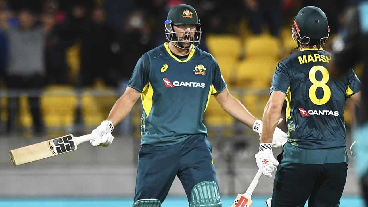 Tim David (left) celebrates with captain Mitchell Marsh